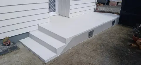 Resurfaced concrete steps and landing