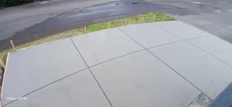 New concrete driveway with a curved edge in Palmerston North
